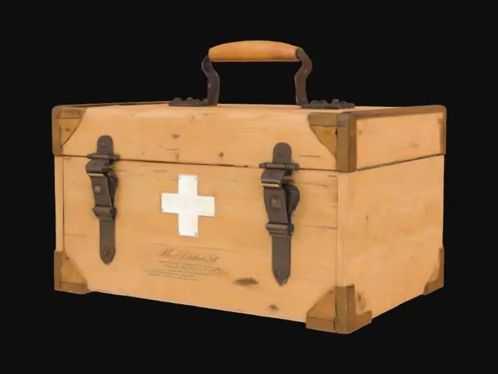 3D model for A rustic, rectangular wooden medical kit, resembling those used in WW1, made from light, untreated pine. Its surface is weathered and marked with scuffs and faint scratches, revealing a coarse, splintery texture that feels dry to the touch. The wood is a faded, natural beige, held together by visible dovetail joints at the corners and reinforced with dark, oxidized metal latches and a simple, thick handle on top. It conveys a utilitarian, worn aesthetic.