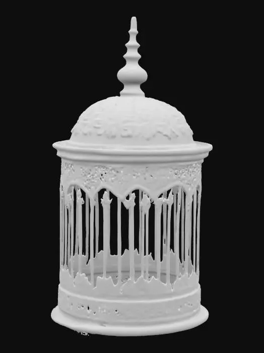 3D model for old coper birdcage , The object is a cylindrical birdcage with a domed top, featuring ornate metalwork with floral and geometric patterns and a rustic bronze finish.