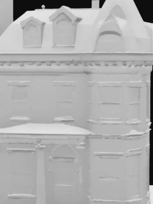 3D model for 1880s mansard town house in Boston. Color scheme is brick, with white stone detailing of the neoclassical style near the bottom, fancy red door with wainscotting, & a side turret. Roof is a copper gray-green color.