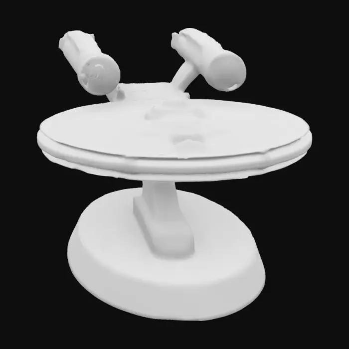 3D model for A 1 meter model of The USS Enterprise 1701A, tabletop miniature starship, Star Fleet Battles, game miniature, made of pewter and painted for Christmas. NVIDIA volumetric lighting, engine glow, on a gold wizkids heroclix base, deeply carved details. #ChristmasAdventure#