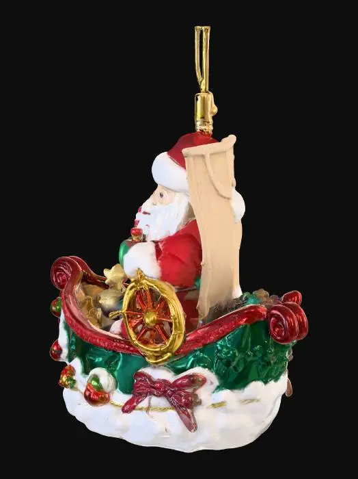 3D model for Create a Christmas tree ornament in the shape of a ship with Santa Claus inside in holiday colors.