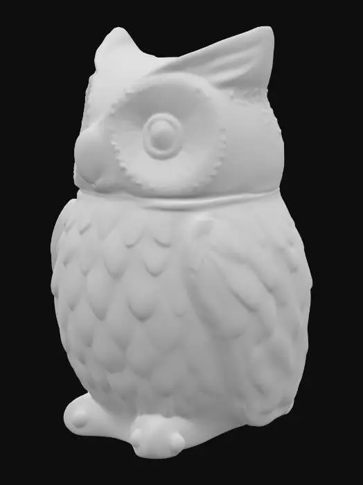 3D model for A charming, small trinket jar is meticulously crafted to resemble a plump owl. Made from smooth, glazed ceramic, its surface is cool and hard to the touch, painted in warm, earthy tones of brown and cream, with distinct feathery patterns. The owl's head is a separate piece, serving as the lid, designed to fit snugly onto the hollow body, creating a seamless appearance when closed. Its large, round eyes give it a wise, whimsical expression.