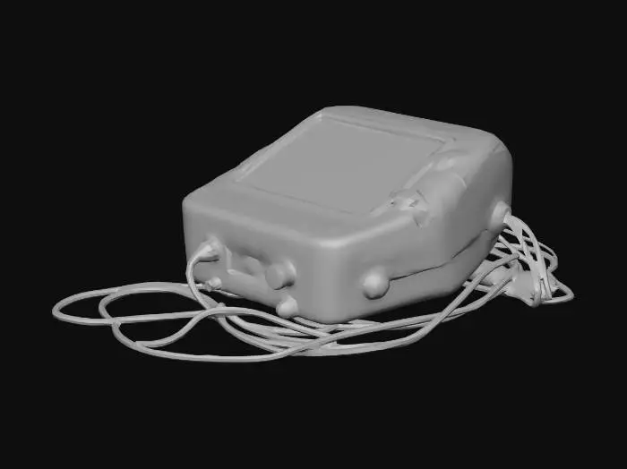 3D model for A game-ready, medium-polygon 3D model of a compact, portable medical device lying discarded on the floor, adhering to a realistic, gritty, and post-apocalyptic hospital aesthetic. It has a boxy, industrial design with a scratched and cracked light grey plastic casing. Attached black cables are tangled. Its small screen is dark, and buttons appear unresponsive, covered in dust.
