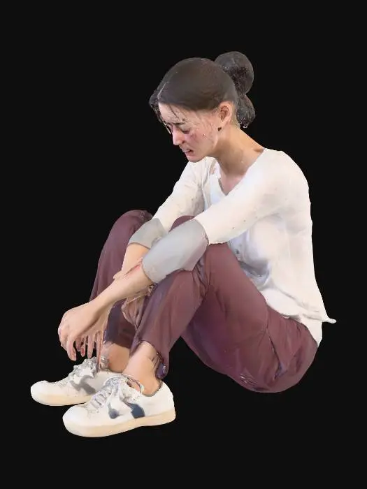3D model for A woman sitting on the floor crying and looking very sad