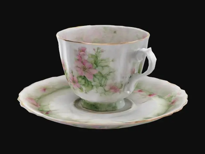 3D model for porcelain teacup and saucer, delicate pink and green flowers surround the edge


