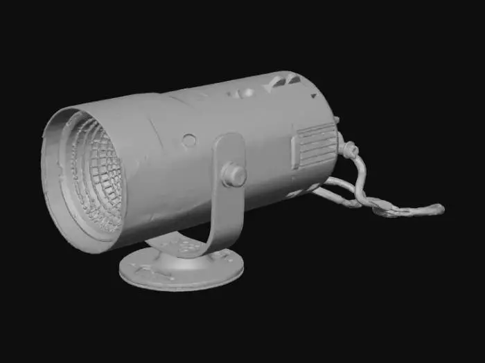 3D model for High-end professional LED spotlight fixture mounted overhead. Brushed aluminum body (roughness 0.3), visible fingerprints, glass lens with subtle smudges. Strong focused beam on podium, 4000K warm light. Include visible mounting bracket and cable.