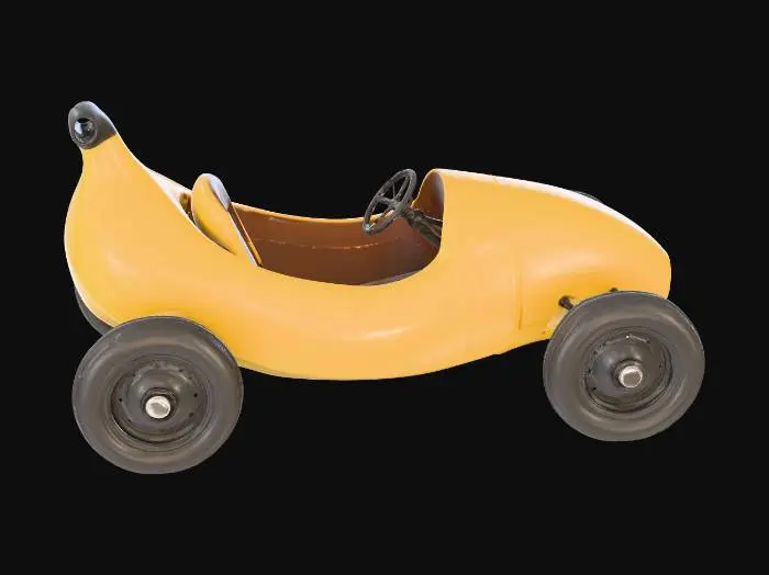 3D model for A low-poly 3D vehicle model of a giant banana converted into a race car. The banana body is curved and sleek with a vibrant yellow matte texture. Include four black rubber wheels attached to the sides with simple metal axles. Feature an open-top cockpit cut into the middle of the banana with a basic steering wheel and a single seat. Style: stylized low-poly, clean flat shaded polygons, game-ready topology, no complex textures