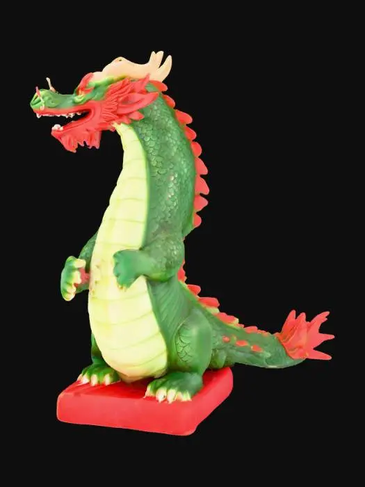 3D model for A stylized oriental dragon sculpture, intricately designed with a serpentine green body and lighter green belly scales, featuring bold red accents on its mane, tongue, and tail tip. The creature is tightly coiled around a robust, fluted column, which is decorated with striking red and green vertical stripes. Its head is expressive, with whiskers, small horns, and an open mouth revealing sharp teeth. The entire piece boasts a smooth, glossy finish, suggesting a polished ceramic or painted plastic material, and the column stands on a distinct red base.