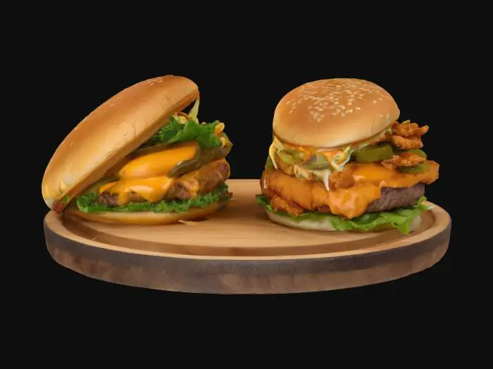 3D model for Two juicy gourmet hamburger, one with double beef patties, cheddar, lettuce, and pickles; the other with crispy fried chicken, coleslaw, spicy mayo, and sesame bun 