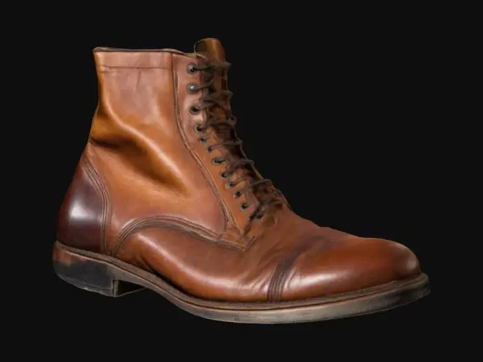 3D model for A vintage brown leather man's boot. Polished but slightly worn and aged looking. Stitched leather pieces. Thick leather sole. Old looking but cared for.