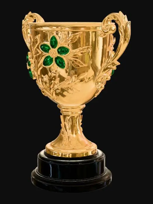 3D model for Visual Description of the Luxury Trophy
This image features a stunning, high-end trophy that combines classical goldsmithing with fine jewelry techniques.

Structure and Materials
The Body: A chalice-style cup made of polished yellow gold with a mirror-like finish.

The Handles: Two ornate, baroque-style handles sweep out from the sides, intricately carved with acanthus leaf motifs.

The Base: The gold stem rests upon a multi-tiered, jet-black cylindrical pedestal (likely onyx or polished lacquer), providing a sharp, sophisticated contrast to the gold.

Gemstone Details
The most striking feature is the floral arrangement "climbing" the front of the cup:

Emerald Petals: Two large flowers are set with vibrant, deep green emeralds cut in pear shapes.

Diamond Centers: The heart of each flowe
