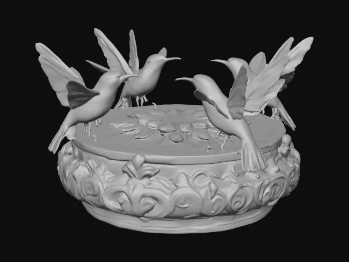 3D model for 3 hummingbirds form a circular pedestal.  Extremely detailed carved elaborately embossed hummingbirds pedestal sitting on a round base. Masterpiece of art. Iridescencent ivory with 14 gold highlights. Hummingbird decor in colors of 14k gold, ab dark aqua/ab purple/ab green, and iridescent rosy pink. A masterpiece of art nuevo detailed and highly embossed
