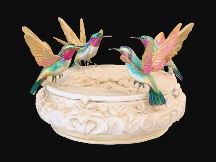 3D model for 3 hummingbirds form a circular pedestal.  Extremely detailed carved elaborately embossed hummingbirds pedestal sitting on a round base. Masterpiece of art. Iridescencent ivory with 14 gold highlights. Hummingbird decor in colors of 14k gold, ab dark aqua/ab purple/ab green, and iridescent rosy pink. A masterpiece of art nuevo detailed and highly embossed