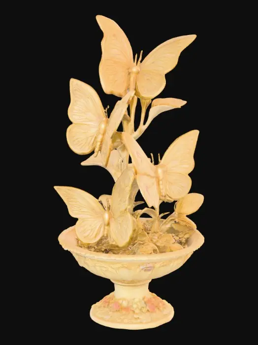 3D model for A pedestal comprised of three butterflies that are holding a bowl shapped base above their wings. The complete design is on a 3 inch round base. Victorian, Extravagant, elaborately embossed design. A masterpiece of art nouveau, lush botanicals are interwoven into the design