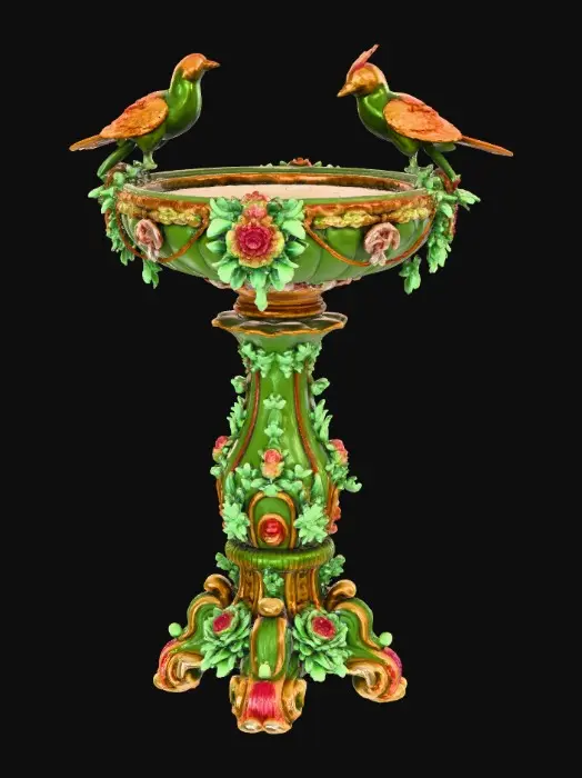 3D model for An elaborately designed pestal with a small bowl shapped base on top. The pedestal sits on a 3 inch base plate. The entire design is a masterpiece of art comprised of lush botanical, florals, cherubs and birds. Elements of Rocco, art nuevo era. Colors representing the victorian era.