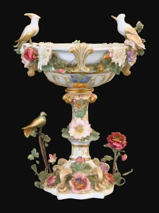 3D model for An elaborately designed pestal with a small bowl shapped base on top. The pedestal sits on a 3 inch base plate. The entire design is a masterpiece of art comprised of lush botanical, florals, cherubs and birds. Elements of Rocco, art nuevo era. Colors representing the victorian era.