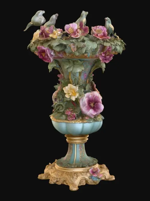 3D model for An elaborately designed pestal with a small bowl shapped base on top. The pedestal sits on a 3 inch base plate. The entire design is a masterpiece of art comprised of lush botanical, florals, cherubs and birds. Elements of Rocco, art nuevo era. Colors representing the victorian era.