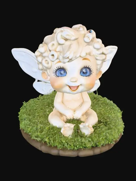 3D model for Ceramic figurine of a Chibi child like snowdrop fairy. Perfect facial features with well formed arms, hands, legs, & feet. Well defined wings. Fairy is sitting on a round patch of grass. Beautiful full wide smile laughing uncontrollably. Twinkling large blue eyes. Wild thick Curly hair