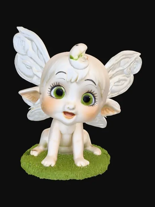 3D model for Ceramic figurine of a Chibi child like snowdrop fairy. Perfect facial features with well formed arms, hands, legs, & feet. Well defined wings. Fairy is sitting on a round patch of grass.