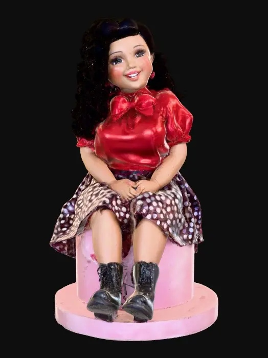 3D model for The plump Latina doll has luminous black curly hair. she has very large brown eyes with thick dark eyelashes. her head is thrown back as She is laughing with joy as she sits on a round base. She is wearing a corset type red satin top with a full ruffled polka-dots skirt. She has cute black boots. and a red velvet bow in her hair.