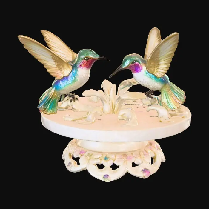 3D model for 3 hummingbirds form a circular pedestal.  Extremely detailed carved elaborately embossed hummingbirds pedestal sitting on a round base. Masterpiece of art. Iridescencent ivory with 14 gold highlights. Hummingbird decor in colors of 14k gold, ab dark aqua/ab purple/ab green, and iridescent rosy pink. A masterpiece of art nuevo detailed and highly embossed