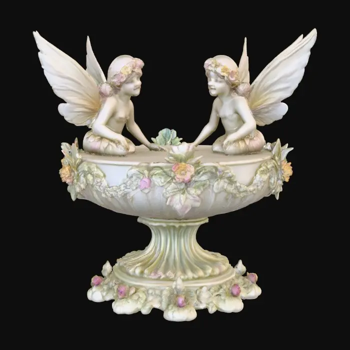 3D model for A pedestal comprised of small fairies that are holding a bowl shapped base above their heads. The complete design is on a 3 inch round base. Victorian, Extravagant, elaborately embossed design. A masterpiece of art nouveau, lush botanicals are interwoven into the design