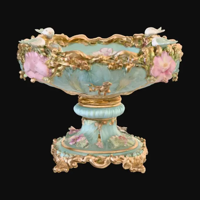 3D model for An elaborately designed pestal with a small bowl shapped base on top. The pedestal sits on a 3 inch base plate. The entire design is a masterpiece of art comprised of lush botanical, florals, cherubs and birds. Elements of Rocco, art nuevo era. Colors representing the victorian era.