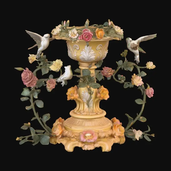 3D model for An elaborately designed pestal with a small bowl shapped base on top. The pedestal sits on a 3 inch base plate. The entire design is a masterpiece of art comprised of lush botanical, florals, cherubs and birds. Elements of Rocco, art nuevo era. Colors representing the victorian era.