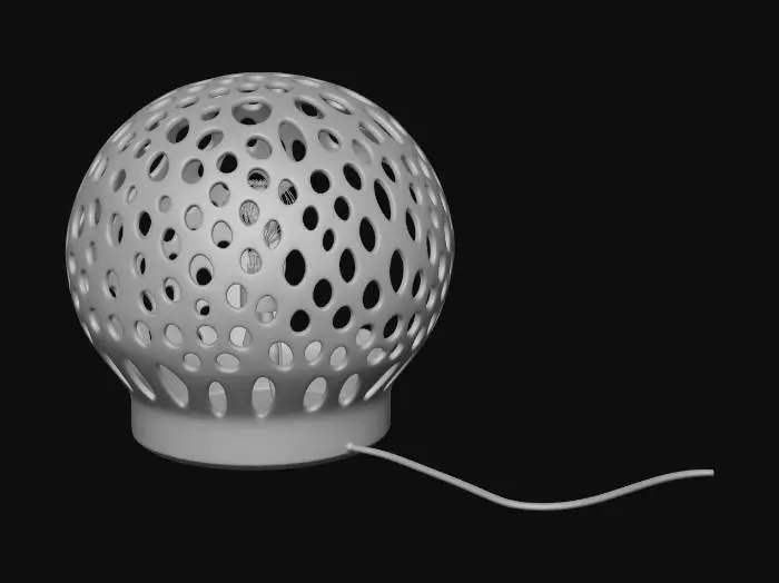 3D model for Eine filigrane Nachttischlampe im Voronoi-Stil, geformt wie eine schwebende Qualle. Gefertigt aus hellem Holz, ist sie komplett hohl und zeigt eine komplexe, organische Zellstruktur. Unter dem durchbrochenen Qualle-Schirm befindet sich eine kleine LED-Birne. Ein diskreter Kabelkanal verläuft von dort bis zur stabilen Basis. Die Oberfläche ist glatt, aber haptisch reich durch das faszinierende Muster.