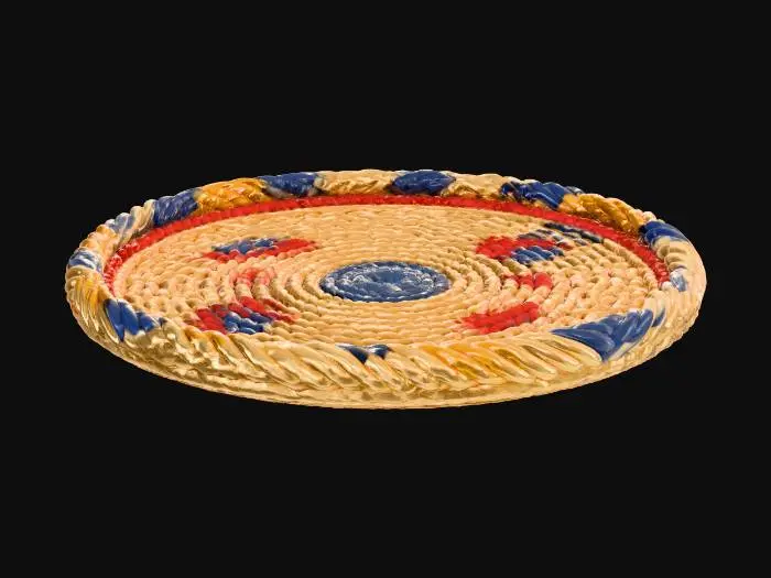 3D model for A woven rattan-style round coaster, 10cm diameter, designed for 3D printing. The surface shows tightly interlaced straw texture arranged in a spiral radial pattern. Add colorful geometric embroidery accents in red, blue, and yellow around the center, inspired by Filipino handmade basket designs. Flat base, no holes, smooth underside for stable printing, realistic PLA texture.”