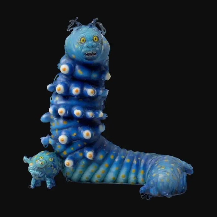 3D model for The object is a segmented, caterpillar-like sculpture with a humanoid face, coiled body, and a textured surface reminiscent of organic ridges and bumps.
