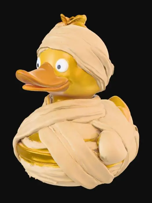 3D model for An eerie rubber duck, designed like a mummified creature. Its surface has a dry, slightly crinkled texture, mimicking aged linen bandages wrapped haphazardly around its body, obscuring parts of its original duck shape. Faint, sepia-toned yellow peeks through the gaps in the off-white wraps, and its eyes are recessed, painted black with small, unnerving pinpricks of white. The material feels dense and slightly rigid, not as squishy as a typical rubber duck.


  Optimized for 3d printing