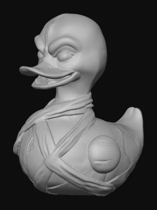 3D model for A menacing rubber duck, re-imagined as a mummified creature, features an aged, off-white surface with a dry, slightly crinkled texture. Its body is haphazardly wrapped in linen-like bandages, partially obscuring the familiar duck silhouette. A gaunt mummified rubber duck, its once vibrant yellow form now shrunken and desiccated. The rubber material appears brittle and aged, with fine cracks and a dusty, papery texture resembling ancient linen wrappings. Its menacing posture is accentuated by sharp, exaggerated edges and a gaunt body revealing hints of bone structure beneath the shriveled surface. Deep-set, hollow eye sockets stare out like vacant pits, devoid of life, giving the creature a profoundly unsettling and macabre presence.
optimized for 3d printing