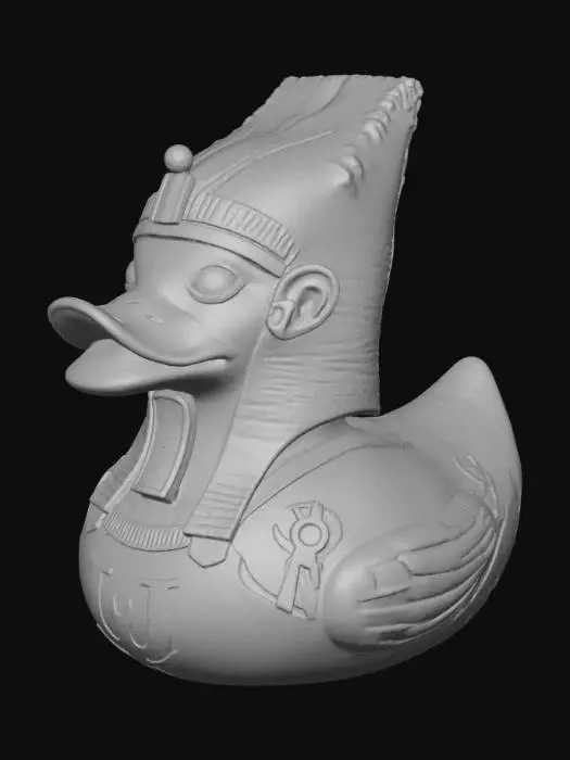 3D model for A dark, mummified Pharaoh rubber duck, solid 3D model for printing. The classic rounded duck body is gaunt and wrapped in aged, tattered linen bandages with rough texture and uneven layers. Beneath the wraps, faded yellow plastic shows through in worn patches. The duck wears a weathered Egyptian Nemes headdress, partially torn, with a short, cracked ceremonial beard extending from its beak. Deep, shadowed eye sockets give it a lifeless, haunting stare. Its chest bears faint, eroded hieroglyphic carvings and embossed ankhs, barely visible beneath the wrappings. The form is bold and compact, with watertight geometry, no thin parts, and subtle surface wear that suggests ancient decay.