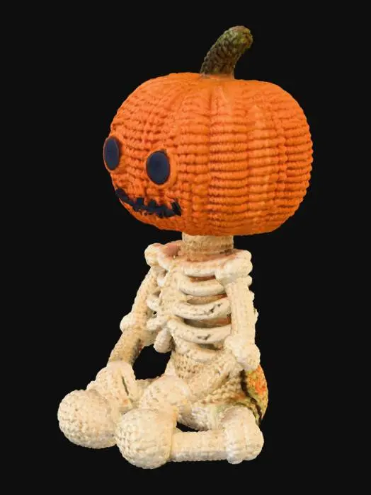 3D model for A cozy, handcrafted 3D Halloween skeleton with a pumpkin head, designed in the style of a knitted or crocheted amigurumi toy. The pumpkin head has a friendly yet spooky carved face, with visible yarn fibers, soft wool texture, and small handmade imperfections. The cream-colored skeleton body is fully crocheted, with detailed loops and interwoven strands. The character is sitting — either cross-legged or with legs outstretched — in a relaxed, cute pose. The overall style is warm, whimsical, and slightly eerie, like a handmade Halloween collectible. Use soft, diffused lighting and gentle shadows to emphasize the yarn texture and cozy atmosphere.