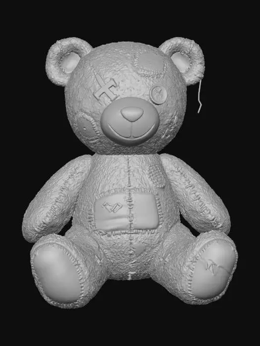 3D model for ein alter kaputter Spielzeug TeddyBär der schon mehrmal gepflickt wurde. Sitzt auf dem Boden.