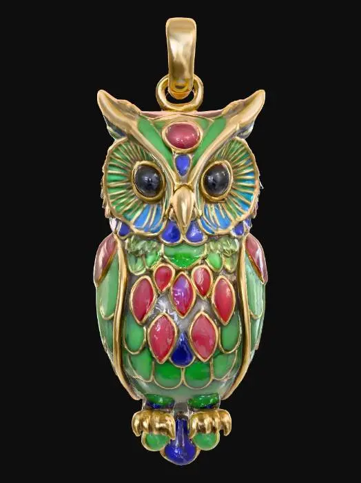 3D model for An intricately designed owl pendant, crafted from smooth, glossy enamel over a metal base. Its surface displays vibrant, deep jewel-toned colors like emerald green, sapphire blue, and ruby red, with subtle gold accents outlining its feathers and wide, attentive eyes. The enamel gives it a slick, cool-to-the-touch feel, and its three-dimensional form features gently rounded edges and a slightly convex body, capturing the graceful contours of an owl. 