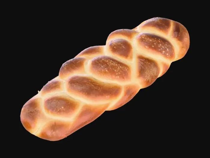 3D model for “Realistic 3D model of a traditional braided challah bread loaf. Golden-brown baked crust with glossy shine from egg wash, braided texture clearly visible. Slightly irregular handmade look, sprinkled with sesame seeds. Dimensions approx. 30 cm long, 12 cm wide, 10 cm high. PBR materials with diffuse color, roughness, and normal map. Topology clean, low-poly friendly. No packaging, no plate, just the bread loaf isolated.”
