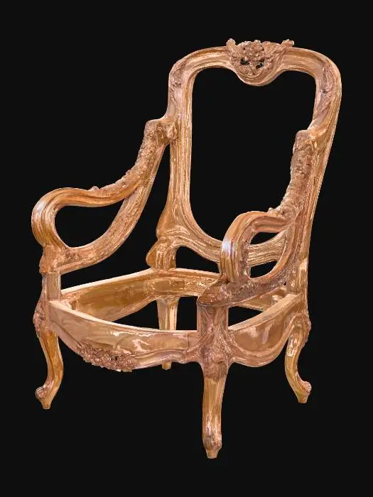3D model for An ornate, unpolished wooden chair frame, exhibiting a rich, light to medium brown natural wood color with visible grain. Its Rococo-inspired design features gracefully curved cabriole legs with subtle claw feet, and elegantly scrolled armrests. Intricate, detailed carvings of floral and leaf motifs adorn the armrests, front apron, and particularly the crest rail of the high back, giving it a tactile, textured surface that contrasts with the smoother polished sections. The frame has an open seat and back, ready for upholstery.