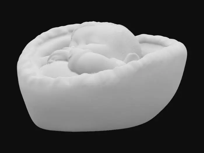 3D model for Create a heart-shaped keychain that cradles a sleeping infant inside