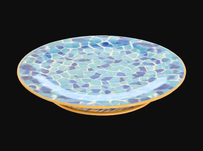 3D model for A set of fine porcelain plates, each perfectly round with a gently raised rim, displaying a lustrous ivory white base. Their surfaces are adorned with a meticulously rendered, raised gold enamel pattern depicting swirling baroque motifs, adding a subtle tactile dimension. The glaze is flawlessly smooth and cool, reflecting light with a soft glow, and the plates have a delicate yet surprisingly durable feel.
