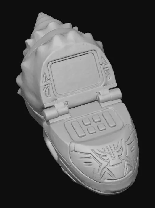 3D model for A **rugged personal data terminal**, its clamshell design featuring **bone-colored, textured plating** resembling a fossilized shell. **Dark bronze hinges** and a **desaturated indigo screen** are integrated, with **faded terracotta function keys**. Its surface has **intricate tribal etchings** and signs of heavy use, defining a **Wabi-sabi Cyberpunk aesthetic** of enduring knowledge and a strong **humanistic narrative tension**.