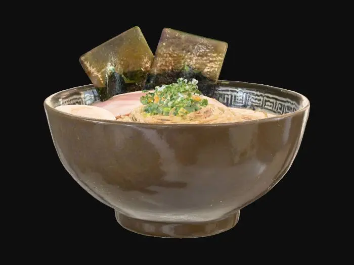 3D model for A steaming bowl of ramen, presented with an artful arrangement of ingredients. Long, pale yellow noodles coil at the bottom, partially submerged in a rich, opaque broth of a light brown hue. Thin slices of pinkish-white pork belly and a perfectly halved soft-boiled egg with a vibrant orange yolk rest on top. Bright green scallions and dark sheets of nori seaweed add contrasting textures and colors, creating a visually appealing, aromatic dish.