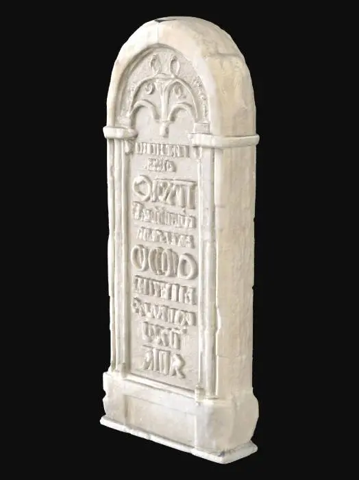 3D model for A substantial slab of stone, likely a muted grey or earthy hue, lies with a distinctly weathered appearance. Its surface feels rough and cool to the touch, bearing the marks of significant exposure to the elements. Intricate writing, rendered in a gothic font, is deeply chiseled into the stone. The lines of the inscription are softened and eroded by time, giving the text a faded yet distinct quality, emphasizing the ancient craftsmanship.