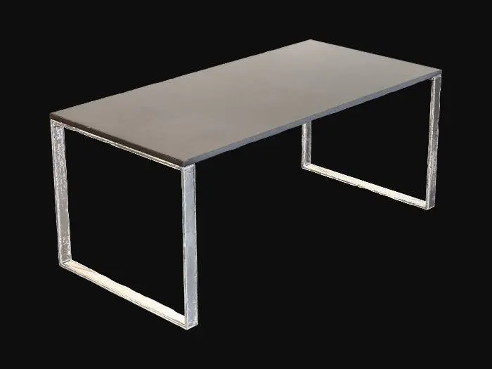 3D model for 一张现代风格的办公桌，其桌面由光滑的深灰色或哑光白色人造板构成，边缘线条笔直流畅。桌体采用坚固的金属框架支撑，表面通常是拉丝处理或哑光喷漆，呈现出银色、黑色或炭灰色。桌面触感平滑且凉爽，带有微妙的光泽。整体造型简洁利落，几何感强，强调功能性和极简美学，没有多余的装饰，结构稳固。