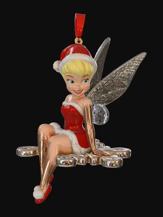 3D model for Tinkerbell as a christmas tree ornament in a red santa outfit, sitting on a snowflake