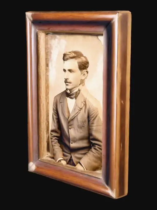 3D model for An old sepia-toned family photo in a small wooden frame on the desk. The photo shows a man in early 1900s clothing with faint scratches and fading, symbolizing memory and loss. Tags: photo frame, sepia, vintage, emotional, historical.