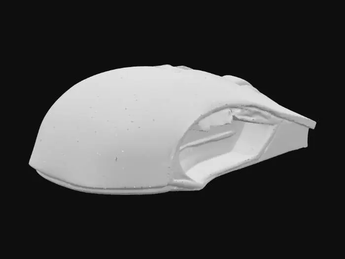 3D model for Игровая мышь имеет обтекаемый, эргономичный корпус из прозрачного пластика, сквозь который просматриваются ее внутренние компоненты. Внутри мыши расположены ярко светящиеся, сложные электронные схемы, излучающие многоцветное, постоянно меняющееся сияние. Пластик корпуса гладкий и прохладный на ощупь, а ее кнопки кажутся упругими и тактильными.