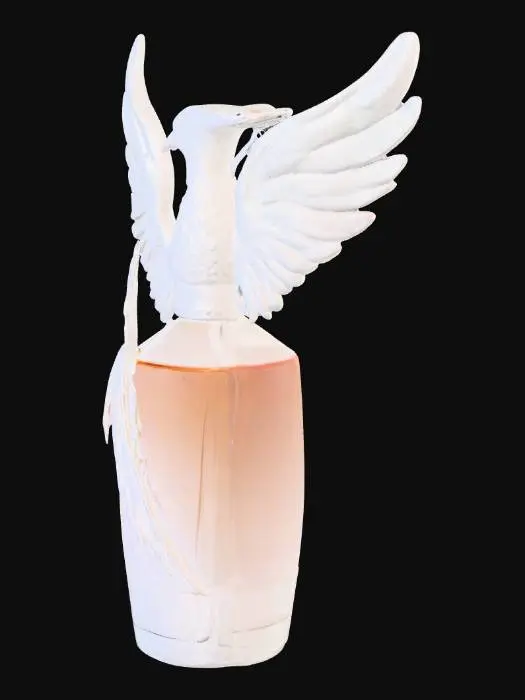 3D model for Стеклянный флакон для духов, искусно выполненный в форме феникса. Его корпус из прозрачного, слегка тонированного стекла, а детализированные крылья феникса изящно обвиваются вокруг основной части флакона. Стекло гладкое и холодное на ощупь, а изогнутые формы феникса выглядят очень утонченно и динамично.