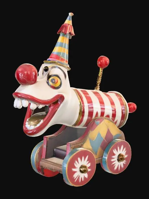 3D model for A whimsical yet slightly eerie clown-themed cannon, its barrel painted in spiraling red and white stripes with glossy enamel. The muzzle is shaped like an oversized clown mouth, teeth painted bright white and lips a vibrant cherry red. Golden bells dangle from the rim, jingling with movement. The cannon’s body is decorated with colorful diamond patterns in yellow, blue, and green, with peeling paint revealing aged brass underneath. Its wheels are oversized circus-style, each with a multicolored spoke design. A small plume of rainbow smoke drifts from the barrel, hinting it’s ready for a playful—but unpredictable—blast.